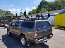 Thule Tracker II rack with 2 Thule Hullavator pro Kayak lift assist system